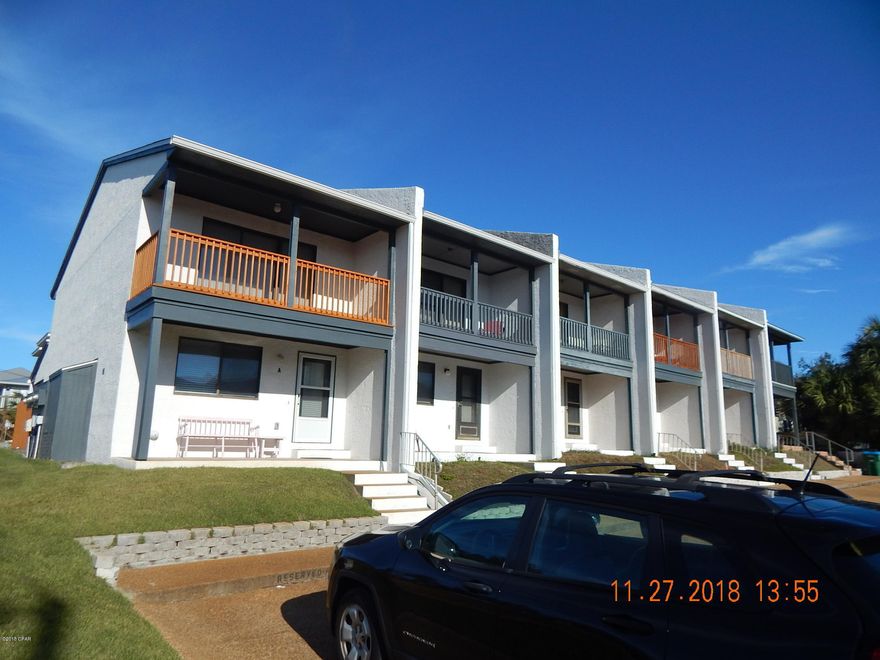 ''CURRENTLY UNDER CONTRACT, SELLER ACCEPTING BACKUP OFFERS''   Great opportunity for a 2nd home or  resort rental investment. This town house is fee simple-- you own it separately from the other units in the building - from the ground up. It has been totally updated and improved from the inner bones to the exterior stucco.  Almost everything has been replaced within the past 2 years- even the potties.  New kitchen cabinets, counter tops, and appliances. New flooring throughout-hardwood tile & carpeting; Updated Bathrooms;  Freshly painted interior & exterior; New privacy fence; Total new HVAC system.  This is essentially a new property .  Only 6 units in the building and the best part--        NO ASSOCIATION FEES.  Located on the quiet end of the beach with a gulf view. Don't miss this one! All information & measurements should be verified by Buyer if important.