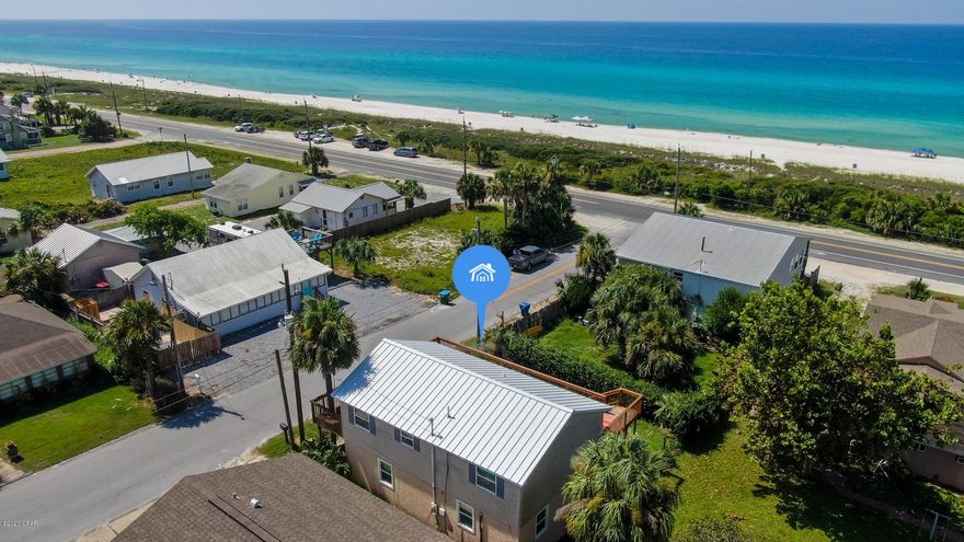 Great 4 bedroom, 3 bath Laguna Beach home only 200' away from the sandy beach. The 2nd floor wrap around deck features gulf views while maintaining a cozy private feel. Many updates recently done including but not limited to a newer metal roof, new hurricane windows, new paint and flooring on first story and much more. The open floor plan on the top level gives a spacious feel while providing plenty of natural light. The first floor includes a game room for entertainment. Great potential for a vacation rental or second home getaway.