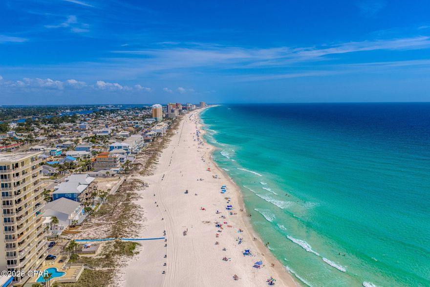 Directly across the street from the Gulf, this 2 bedroom, 2 bathroom townhome offers quick beach access, Gulf views, and updates that help reduce near-term maintenance. Two public beach access points are nearby, and the home is being sold fully furnished, making it a practical option for personal use, a second home, or rental use. For buyers exploring added rental flexibility, the neighboring townhome is also available, creating a rare opportunity to own side-by-side units.

Inside, the layout is set up to comfortably host guests with one king bed and two queen beds. The kitchen, bathrooms, and flooring were renovated in 2019, and the entire unit was freshly painted in 2025, including the walls, trim, and doors. All furnishings were also replaced in 2025, giving the interior a clean, updated feel. A full-size washer and dryer adds everyday convenience.

The living area opens to a private patio where you can enjoy Gulf views and coastal breezes. A fenced backyard provides private outdoor space to unwind after time at the beach. The home also includes a private garage for beach gear, bikes, and other coastal essentials, plus additional driveway parking for guests.

Nearby destinations include Pier Park, St. Andrews State Park, marinas, waterfront dining, shopping, and local restaurants. Buyer to verify all dimensions.