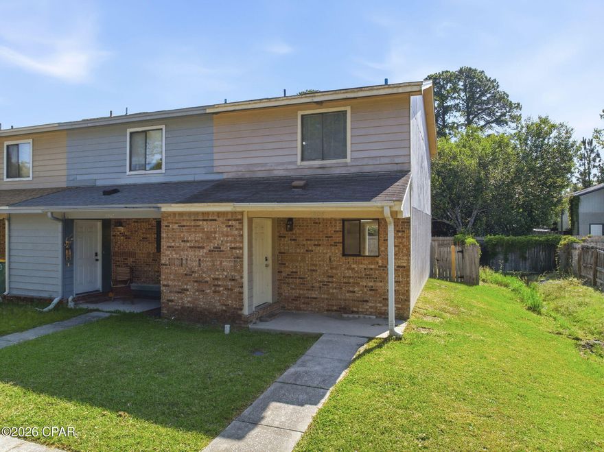 Move right into this well-maintained 2-bedroom, 1.5-bath end-unit townhome--ready for immediate occupancy. Centrally located in Fort Walton Beach, you'll enjoy easy access to Eglin Air Force Base, Hurlburt Field, and a convenient walk to Northwest Florida State College.  

Inside, you'll find a bright and functional layout with durable wood-look tile throughout the main living areas, an updated kitchen with ample cabinetry, and comfortable carpeting in the upstairs bedrooms. The spacious living area opens to the backyard through sliding glass doors, bringing in natural light and creating an easy indoor-outdoor flow.

Updated bathrooms feature modern fixtures, refreshed vanities, and a clean, contemporary look that adds to the home's move-in ready appeal. Storage is a standout feature, with a generously sized primary bedroom closet and extra storage space in the upstairs bathroom to keep everything organized.

What truly sets this home apart is the end-unit position, offering an oversized side yard and backyard--fully fenced for added privacy and perfect for pets, entertaining, or simply enjoying your outdoor space.

Additional highlights include a covered front entry, spacious laundry room, and all appliances--including the washer, dryer and refrigerator--convey with the sale. 

No HOA fees keeps monthly costs down and offers added flexibility for homeowners or investors.

Whether you're looking for a primary residence, rental investment, or a low-maintenance home close to the bases and local amenities, this property checks all the boxes.