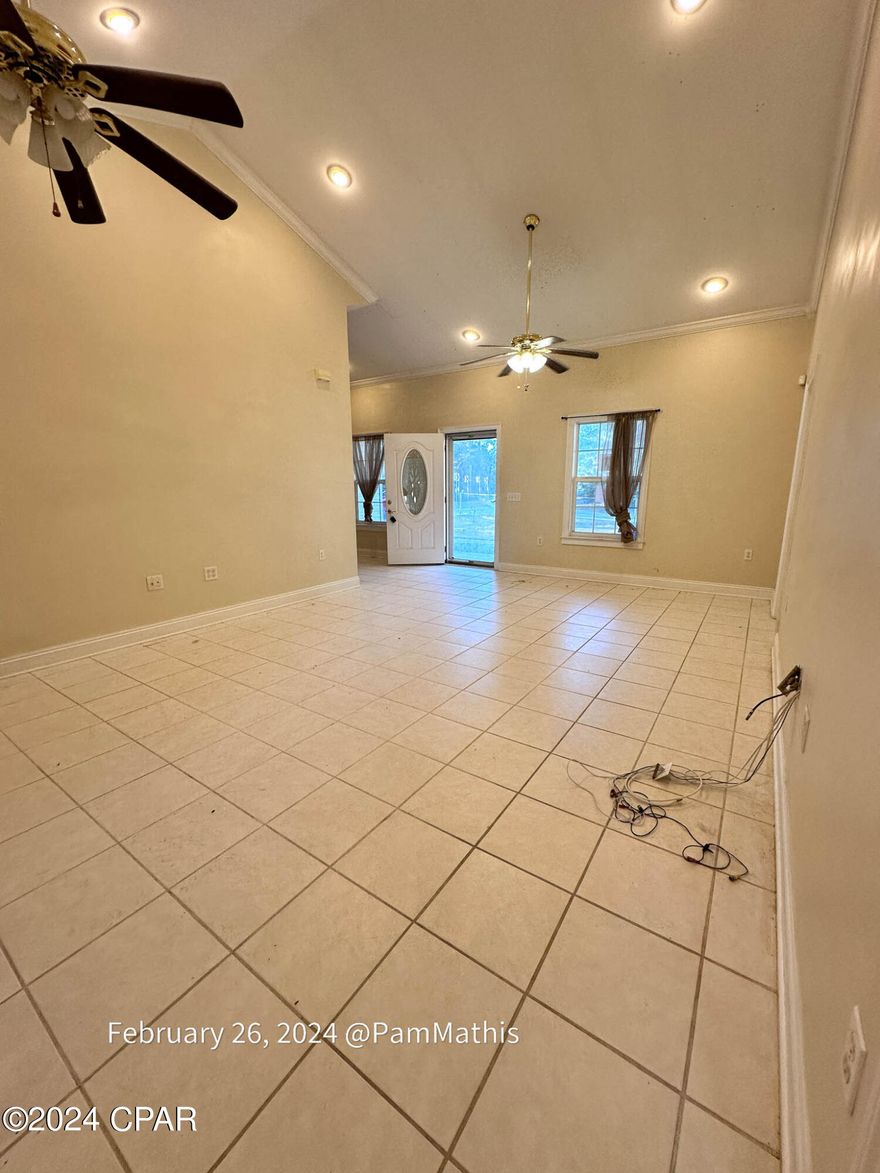 This 3-bedroom, 2-bathroom foreclosure home is located just a short distance from the beach, Pier Park, and the airport. It features a split floor plan, all tile floors, a metal roof, and metal studs. The AC was new in 2017.

The property also includes 2 large outbuildings and a carport. The home has vaulted ceilings and a spacious enclosed porch. The kitchen is large and has plenty of natural light but will need some new appliances . The master bedroom and bath have vaulted ceilings, a walk-in closet, and a walk-in shower. There is also a large laundry room with a sink.

There is some work needed but the potential is certainly there.