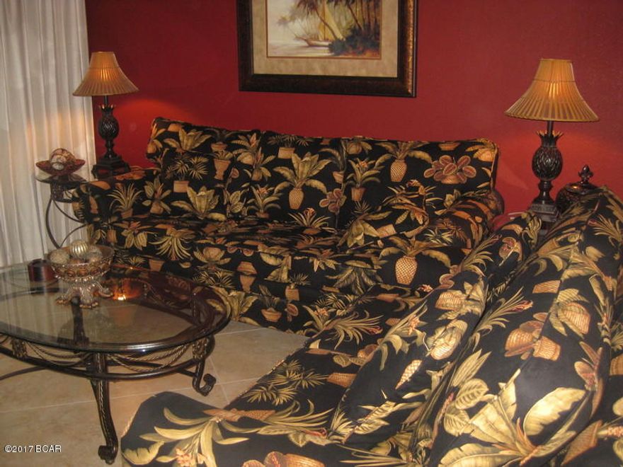 Recently remodeled in beautiful contemporary tropical design, this villa's welcoming and calm décor will make your stay a pleasure, leaving you with a taste of charm and elegance which you will not want to leave.The 2BR/2BA golf villa sleeps six comfortably with a king bed in the master suite, a king bed in the guest suite and a queen sleeper sofa. Along with the living room, both bedrooms have wall-mounted, flat screen TVs and free internet access throughout. 

The kitchen is fully equipped and has granite countertops with elegant tile trim. The villa is furnished with new stainless steel refrigerator,range/oven, dishwasher, microwave and washer and dryer, making your extended stay along the coast an easy pleasure. The entire villa is furnished throughout with fine porcelain tile floori and contemporary colors. The patio has a beautiful and relaxing view of the golf course, complimented with a lake and running.
It is a ground floor unit.