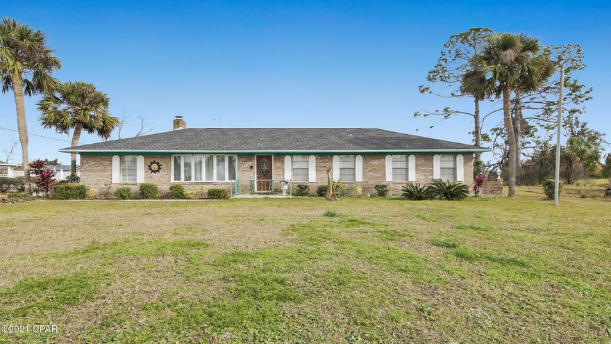 'CURRENTLY UNDER CONTRACT, SELLER ACCEPTING BACKUP OFFERS'

Nice house on large lot in one of Bay County's most desirable areas to live. Situated on a small lake with dock and beautiful water canal views from family room. Oversize driveway, new roof, new septic drain field and updated water conditioning system.

Screened and covered back patio with lake view. Buyer to verify all information.