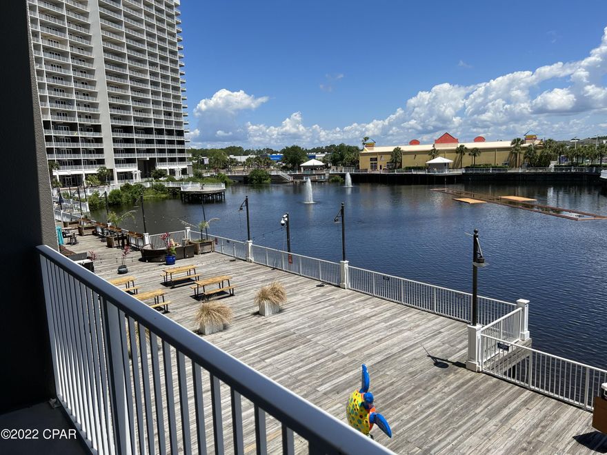 CURRENTLY UNDER CONTRACT, SELLER WILL CONSIDER BACKUP OFFERS. PRICED TO SELL! The perfect blank canvas for the a RE investor! Here's 3 reasons why this is the perfect rental unit! 1. Located on the 1st floor, no wait for those pesky elevators 2. Located in a highly coveted beach resort 3. Restaurant & Entertainment on site. $40k in rental projections! This condo has an absolutely stunning view of the lake and nightly fountain and light show! Laketown Wharf Resort is one of the largest resorts on Panama City Beach. The property is situated along more than 50,000 feet of Lakefront Boardwalk and has a seemingly endless list of amenities to choose from including 5 resort style swimming pools! Enjoy browsing through the many exciting market shops and dining options.