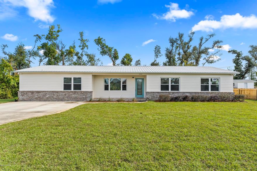 *CURRENTLY UNDER CONTRACT, SELLER ACCEPTING BACK UPS* 4bd, 3ba renovated Lynn Haven block home 2019 metal roof, new hardie board siding, sprinkler system, privacy fence. New drywall, insulated interior walls, double insulation of the exterior walls. Custom kitchen soft close cabinets with matching pantries, corian kitchen countertops, gas range and water heater. Double door refrigerator w/pull out freezer and additional refrigerator in bonus room. Bamboo floors in living, dining room, and hallway. Carpeted bedrooms. Remodeled master bath with granite vanities, separate make up vanity, walk in shower and separate soaker tub, and HUGE master bedroom closet. New sod and both an orange and lemon tree. Creek behind home ensures privacy. Info is approximate and should be verified if important.