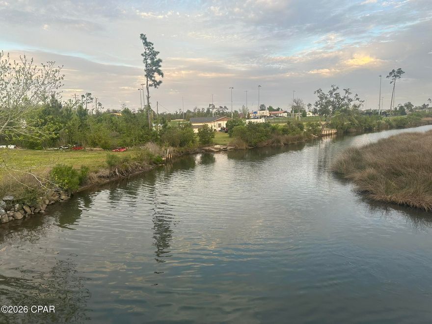 Waterfront in Callaway connects you to the Bay and Gulf. Enjoy the protected harbor in this great bayou location. A great place to build your new home and park your boat out back and enjoy the waterfront!!!
One of the nicest parks in Bay County is across the street from this location with a boat launch, fishing, basketball courts, baseball, walking trails, volleyball and so much to enjoy every day. The John Gore Park is a large waterside park located at 432 Beulah Ave. It is a well-equipped recreational spot that offers a variety of amenities for different interests. It has so much history of Bay County and gives you 11 acres of land and fun activities to enjoy during park hours.

Lot Dimensions: 141' on Viola Ave. 161' X 219' X 90 feet (approximately along water edge) X150' X100' going counterclockwise from POB. (dimensions are approximate.)