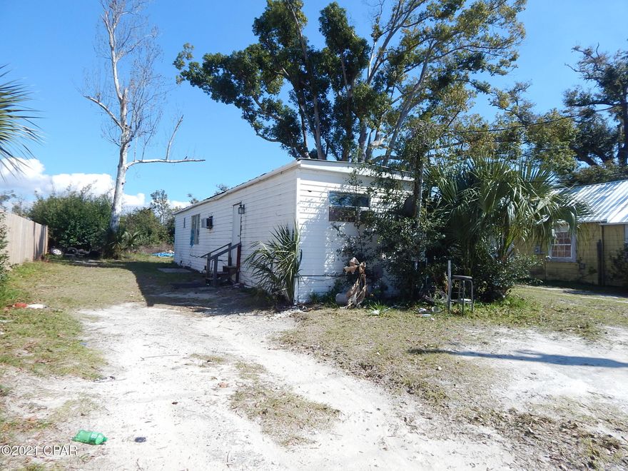 Affordable Lot and Mobile close to Business Highway 98.  Mobile home is 2 bedrooms and 2 full bath.  Large kitchen.  Home does need some minor repairs.