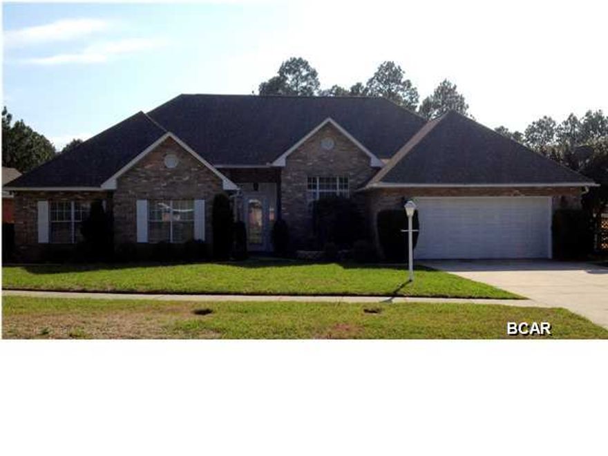 Attractive home in great neighborhood, central to the 23rd Street retail/restaurant area - just one-half mile away, and convenient to TAFB and the beaches. This attractive home includes a low-maintenance brick exterior and a fully-featured interior. The home opens into a large foyer, with both the family room and formal dining room nearby. The family room includes hardwood floors, cathedral ceiling, fireplace; the dining room includes hardwood floors, vaulted ceiling and crown molding; fully equipped kitchen with island and all the appliances (stainless steel), tile floors; adjacent to the kitchen is a den and breakfast area with tile floors; a multi-purpose room, 20'6''x13'3'', (office, rec room, den, 4th bedroom, etc.) , with hardwood floors, opens off the kitchen area; the master