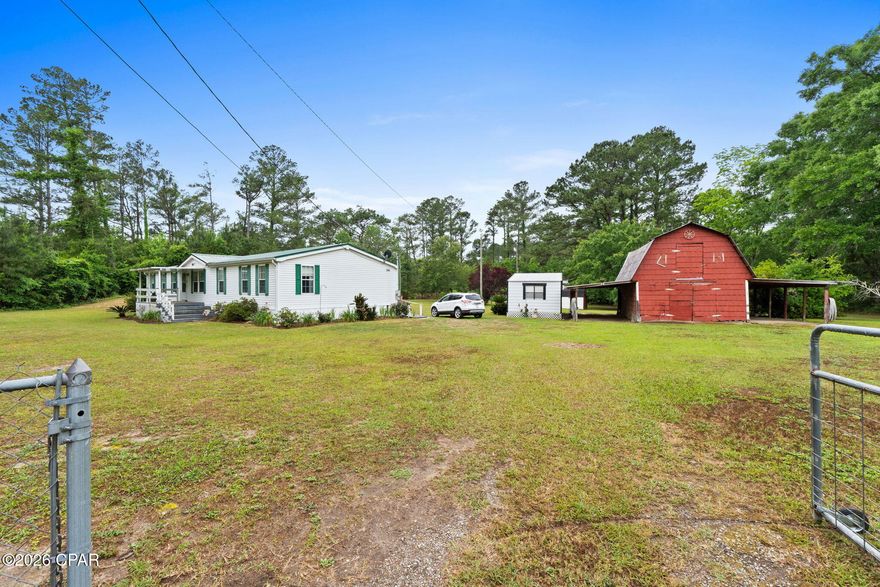 Located in a desirable area with convenience to all medical and shopping. The home sits on over 3 acres completely fenced, with electric gate. The home is over 2000 sq ft. It features 2 living spaces with a fireplace with electric logs in one of them. If your family needs space don't  miss seeing this  home. The kitchen has lots of cabinets with an island, Off the utility is a walk in pantry. Split bedroom floor plan. The master is huge has its own retreat area that can be used for an office or sitting area. Large Master bath and walkj in closet. With the other 3 bedrooms on opposite side of home. This is a must see home if you need space. On the back of the home is a 12 x 32 screened in porch for all your entertaining, Has plenty of outside storage. Don't miss this one, Call your Realtor today and make an  appointment !!!
