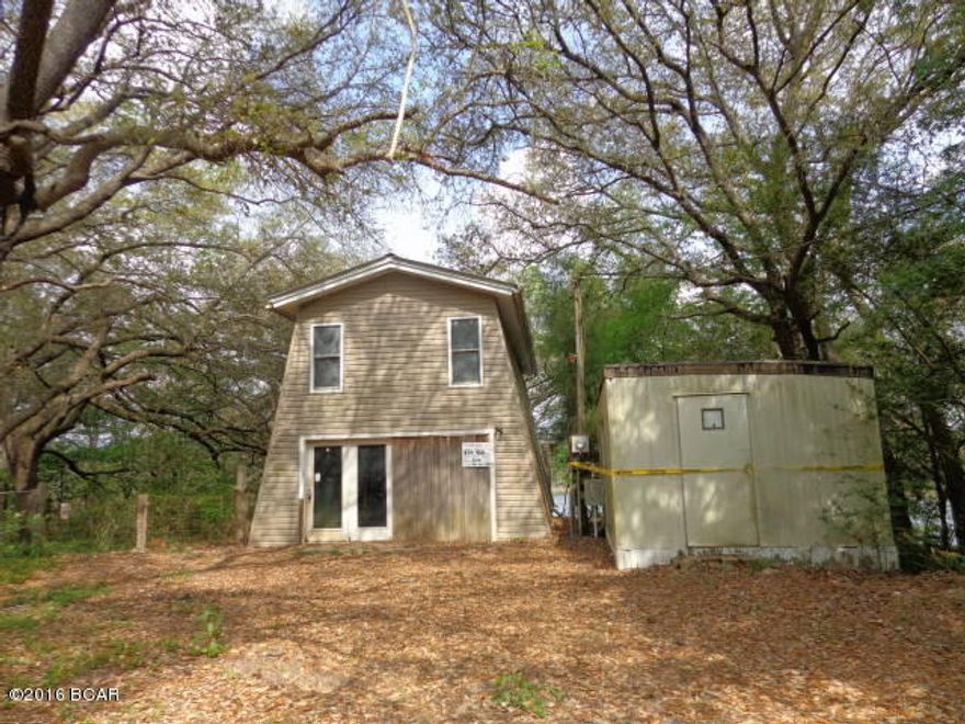 Waterfront on private lake with dock. With repairs and renovations would be a nice weekend getaway or full time retreat. This is no well to this property.