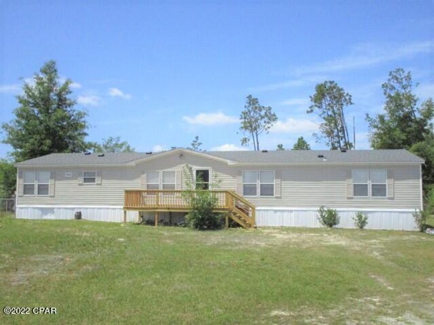 CURRENTLY UNDER CONTRACT, SELLER ACCEPTING BACKUP OFFERS.  This 4/2 Florida home is completely renovated and conveniently located near Panama City. Walking into the home you will see new appliances, new kitchen countertops, new light fixtures, a great den with a wet bar, and a wood burning fireplace! Outside you will find a new roof, new front porch, new side porch, private well, and partial fencing on the lot all for under 200k!
