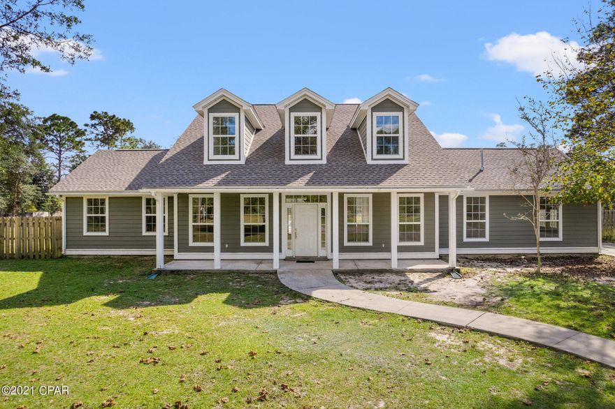 This beautiful country pool home is tucked away on a quiet completely fenced 3.63 acres, close to school,  11 miles to town, & 25 min to beaches.  250' black aluminum fencing with a double gate adorns the front of the property.  Stoneshield LVP flooring compliments the home along with ceramic tile in the laundry room and wood effect tile in the bonus room.  Recently painted. Custom built Oak shelving enhancement in bedroom #4 & the under-stairs closet.   Upgraded Carrara Laza quartz counter tops in the kitchen, new backsplash tiles, 5 burner gas stove, upgraded ceiling fans, new storage cabinet in laundry room and new quartz counter top.  Master bath has molded marble top vanity along with a spa bath and other two baths have granite.  Cool off in the summer in the custom built gunite pool. This unique pool design features 6' deep on both ends and 3' deep in the middle, along with a spa area, swim-out seats with jets, and a trickling waterfall.  A brick surround encompasses the pool filter, heater,  pool salt system, and valves to control the pool.   There are two separate a/c units, one for the first floor and one for the second floor.  Electrical supply for lamp post lights on the gate, circular drive, and RV hookup power pole are wired into dawn to dusk light sensor mount.  The shed is equipped with electrical supply, breaker panel and RV hook up has its own septic tank.  New Roof 2021, A1 Superior maintenanced HVAC along with cleaning of the ducts.  Select Home Warranty in Documents tab.   If measurements deemed important, please verify.