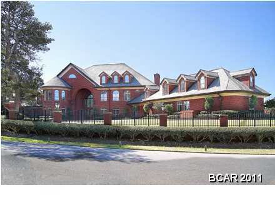 ''This Estate Home is being sold via a Live Auction to be held on Thursday, December 5, 2019. The List Price is the Minimum Bid Price at the Auction plus a 10% Buyer's Premium.'': Impressive,Luxurious.Unparalleled Craftsmanship. just a few adjectives to describe this magnificent home. Situated on 1.6 acres in the Preserve on the Bay. Most prestigious address in Bay County. Ultimate Security (9 foot electronic gates within the gated community) 90 zone security system with 13 Streaming and recorded video cameras. 11'2 ceilings through the home. The Grand Entrance is custom glass inlaid with brass casing. Imported and hand crafted Brazilian Mahogany. 3 cm solid marble tread and stairs. Over $550,000 in custom wood trim and cabinetry. A music room with soaring ceilings. A Ballet Room, sunken l