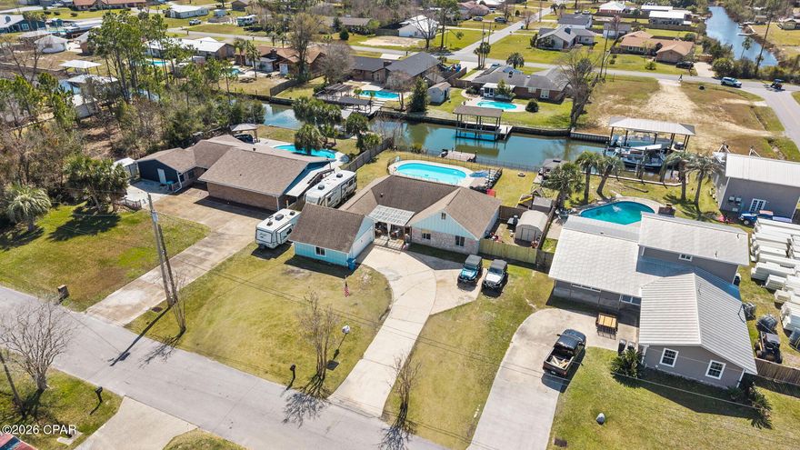 From backyard, to boat, to St. Andrews Bay in just 10 minutes!

Welcome to 1011 Kimberly Lane in Bay Shore Estates -- a beautifully updated waterfront property offering the perfect blend of boating, outdoor living, and modern comfort. Situated on a deep water canal with 97 feet of frontage, a private dock, and seawall this property is truly a boater's dream with only a 10-minute boat ride to St. Andrews Bay and quick access to Shell Island.

The highlight of this home is the incredible backyard retreat designed for entertaining and relaxing. The expansive back deck spans the length of the home and overlooks the canal, while the covered waterfront gazebo provides the perfect spot for grilling, dining, and enjoying sunset views. The pool area features a 15x30 swimming pool surrounded by pavers and a spacious sun deck, creating the ultimate private outdoor escape.

Inside, the 1,752 sq ft home has been fully updated with new luxury vinyl plank flooring installed in 2026, tongue and groove ceilings throughout, and stylish custom built-ins featured in the large open living area. The spacious layout offers three bedrooms, two bathrooms, and a charming dedicated office space perfect for working from home. The large primary suite is accompanied with a spa-like master bathroom designed for comfort and relaxation.

Additional upgrades include a new HVAC system (2022), new hot water heater (2022), and new septic system (2021) providing peace of mind for future owners.

Set on a generous .35 acre lot, the property offers ample parking, storage space, and room to enjoy the outdoors. Located on a quiet dead-end street in Bay Shore Estates, the home provides privacy while still being conveniently located less than 7 miles from Panama City's white sandy beaches. Call your favorite agent today for a private showing! This one will not last long!