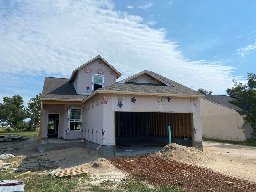 Panama Country Club in Lynn Haven - New Construction

New construction home on PCC's 12th fairway.  Interior will feature Luxury Vinyl Plank flooring, solid surface counters, upgraded fixtures, & stainless steel appliances. Exterior currently features a bay view, panoramic golf course view, covered porch, & a 2-car garage.