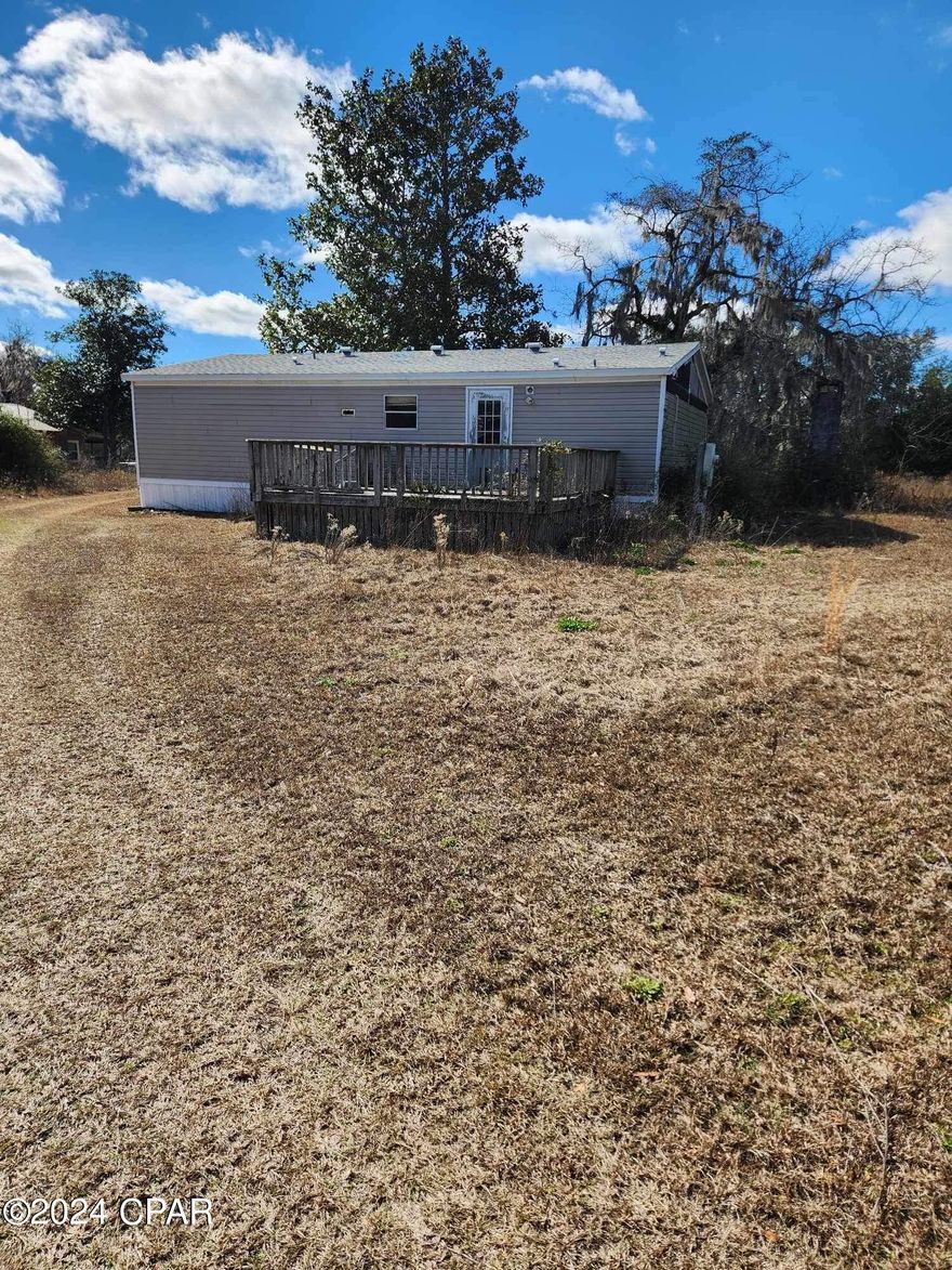 'CURRENTLY UNDER CONTRACT, SELLER WILL CONSIDER BACKUP OFFERS' must be placed at the beginning of the Public Remarks. Discover this spacious double-wide on 2.5 serene acres in the countryside, carpet removed and ripe for remodeling. With ample space inside and out , the potential for customization is endless, whether for modern updates or rustic charm. Enjoy rural tranquility while still being close to essential amenities. Don't miss out on this prime investment opportunity or the chance to create your dream country retreat. Newer roof! House was being used as storage belongings will be moved prior to close.