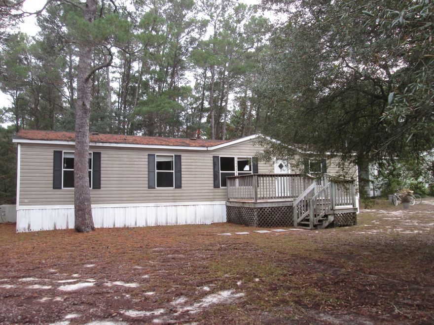 Nestled between Lake Powell and the Gulf of Mexico (less than 1/2 mile from the beach) in the Highly Desirable neighborhood of Inlet Beach sits this 3 bedroom/2 bath home. Location makes this home an easy walk to Lake Powell or the sugar white sandy beaches of the Gulf of Mexico and short drive to Rosemary Beach, Seacrest Beach, Alys Beach or Camp Helen State Park . Home sits on a larger lot with beautiful pine and oak trees. This would be the perfect for investors, weekend get-a-ways or year round living!!! You won't want to miss out on this one!!!  All information is taken from public records, please verify if important to buyers.