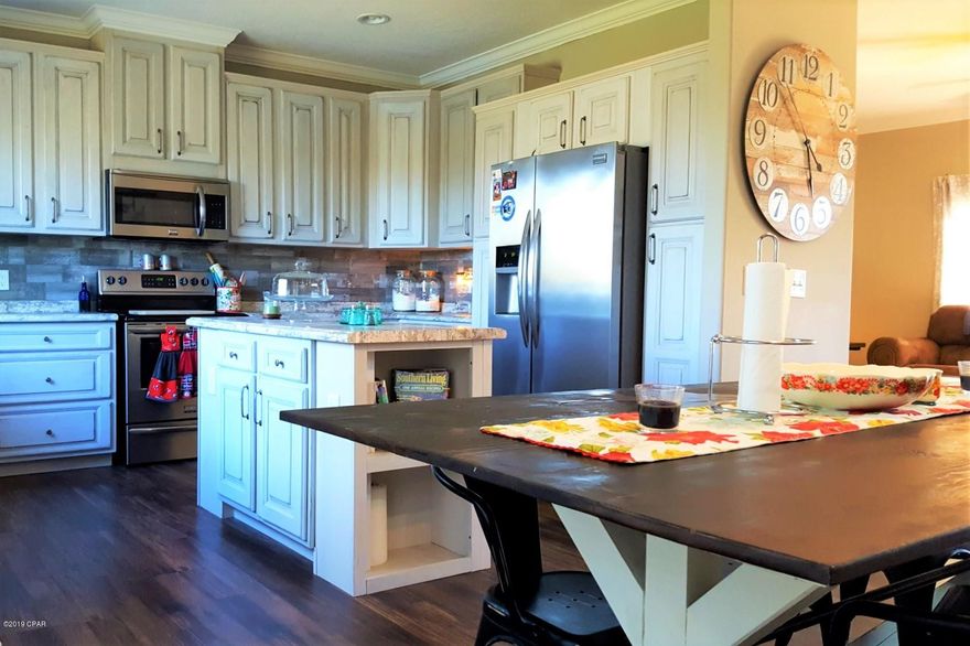 Located on a quiet paved cul-de-sac, this 4-bedroom 2 bath Clayton Home will wow! The large front porch greets you and is the perfect space to watch the kids play in the yard or just enjoy the outdoors and the almost 1.5 acres this home sits on. The spacious living room flows freely into the dining room and family friendly kitchen that features Frigidaire Gallery stainless steel appliances, beautiful ship lap details, island workspace and boasts tons of beautiful antiqued cabinets and a full pantry, hidden by a modern barn door. The split floor plan allows for plenty of privacy for the oversized master suite and ensuite bathroom with double vanity sinks, walk-in glass shower with dual shower heads, soaking tub and huge walk-in closet. The 3 additional ample-sized bedrooms are located on the opposite wing of the home along with a shared bathroom with tub and shower combo and full laundry room that is conveniently adjacent to covered back porch entry. Also, found on this side of the home is a massive bonus room with wet bar that has endless possibilities of becoming your game room, media room, craft room or man cave. This Energy Smart Home has Low-E windows, NEST thermostat, Kevo keyless door entry and RING doorbell systems which are additional features along with the newly upgraded metal roof that must be mentioned. Don't let this amazing opportunity pass you by, call today to schedule your showing!!

Shed does not convey.

(All sizes approximate and taken from public records, Buyer to verify any and all details Buyer deems important.)