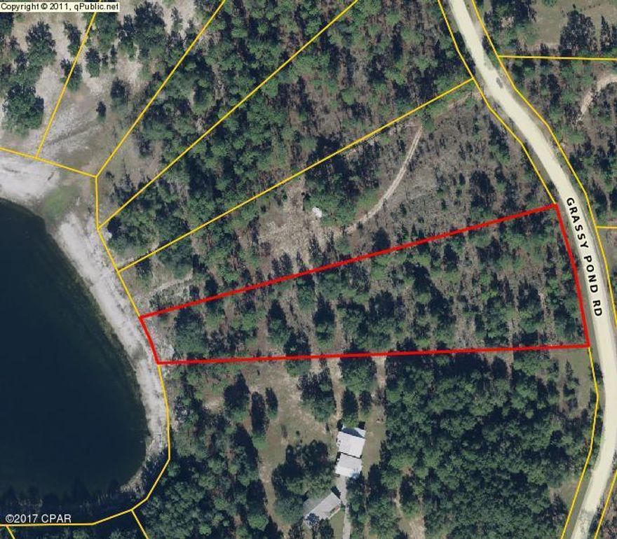 Lakefront Deal! This beautiful 3.53 Acre lot is nestled in the Grassy Pond Ranch Subdivision. It features rolling topography, hardwoods, and a gorgeous lake view from its hilltops. Its conveniently located just 30 minutes North of Panama City and Beaches International Airport. This beautiful piece is just waiting for you to build your Dream Home, or 2nd home on it! Call today to schedule your Showing!