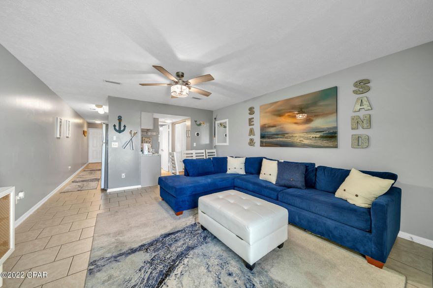 Centrally located and with the best of both worlds, this property will be fantastic as a home away from home- or a passive income generator! Welcome to 301 Lullwater Drive #413! This 2-bedroom 2 bath lake front condo is just a block away from the pristine beaches of the Gulf of Mexico and convenient to Pier Park with shopping, dining, entertainment, and nightlife. Fully furnished with modern furniture and coastal décor, this beautiful condo has plenty of room to sleep up to six people. Relax with low maintenance LVP floors for easy cleanup after a day at the beach and enjoy updates such as new stainless-steel appliances, modern fixtures, and a breakfast bar. You or your guests can also sit in the spacious living room or on the deck and enjoy the views of Lullwater Lake. Step into a gorgeous master bedroom with lots of space, attached bathroom, and a view of the lake. Second bedroom connects its own separate bathroom which can also be used by guests with a separate entry from the living room. Don't want to leave for the day? Even if you're not interested in going off property, guests and residents have access to grilling and fishing off the private dock, shuffleboards, pool, and of course, the beach access. Don't miss your chance to own this little slice of heaven right here in Panama City Beach! All dimensions to be verified by buyer.