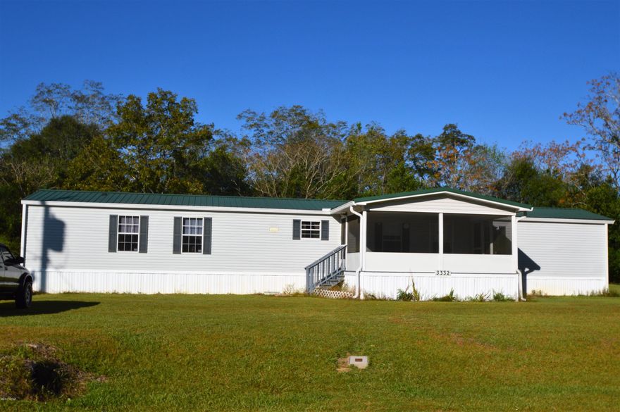 Very well maintained 16x80, 3 bedroom 2 bath home. Large front screened porch, great for entertaining. City water and septic tank. Comes with the furnishings and appliances you see.