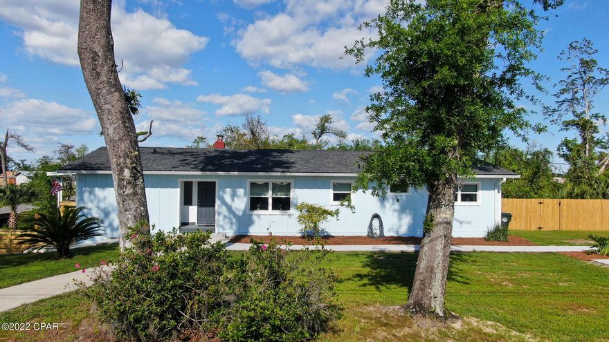 This beautiful newly renovated 4 bedroom, 3 bath home sits on a huge corner lot in desirable Lynn Haven! Multiple parking areas with plenty of room for your boat, RV and friends and family. Large fenced in back  yard with lots of room for kids and pets! Close proximity to parks, boat ramps and schools.  Custom kitchen features new cabinets, quartz countertops, upgraded Samsung kitchen appliances with smart connect (wi-fi) and Air Fryer.  And of course, a Wine Chiller for entertaining! Master bath has separate tiled shower and free-standing tub. Downstairs living space has exposed wood beams and fireplace. Large laundry room with chute for added convenience.  Garage is large enough for a workshop. Come check out this gorgeous, move-in ready home....it won't last long!