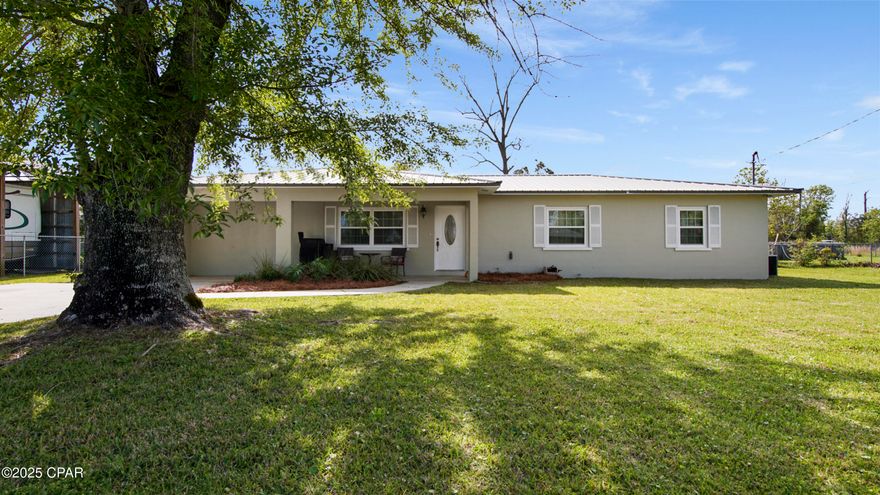 CURRENTLY UNDER CONTRACT, SELLER WILL CONSIDER BACKUP OFFERS 3 Bedroom/ 2 bathroom home located just off East Ave. near Tyndall AFB, restaurants, schools, shopping and more. Situated on a spacious .34 acre, this home's exterior showcases a fenced backyard with shed, oversized driveway, and a large covered front porch! Inside showcases an open-concept floor plan with tile flooring, and recessed lighting throughout all common areas; Living room and hallways feature a beautiful blue trim and wainscoting  combo along the walls. Kitchen features granite countertops, tile backsplash, stainless steel appliances, and island/ breakfast bar overlooking the eat-in dining area. Secondary bedroom features lvp flooring while the full guest bathroom showcases two vanity's', separate tiled shower + secondary tub/shower combo lined with tile. Large master bedroom and en-suite features lvp flooring, beautiful wainscoting, sitting area, free standing tub, and walk-in closet. Situated off the dining area sits the 3rd bedroom featuring carpet flooring, paneled ceiling, and laundry room. 
Call to schedule your private showing today! All Measurements approx. buyer to verify if important.