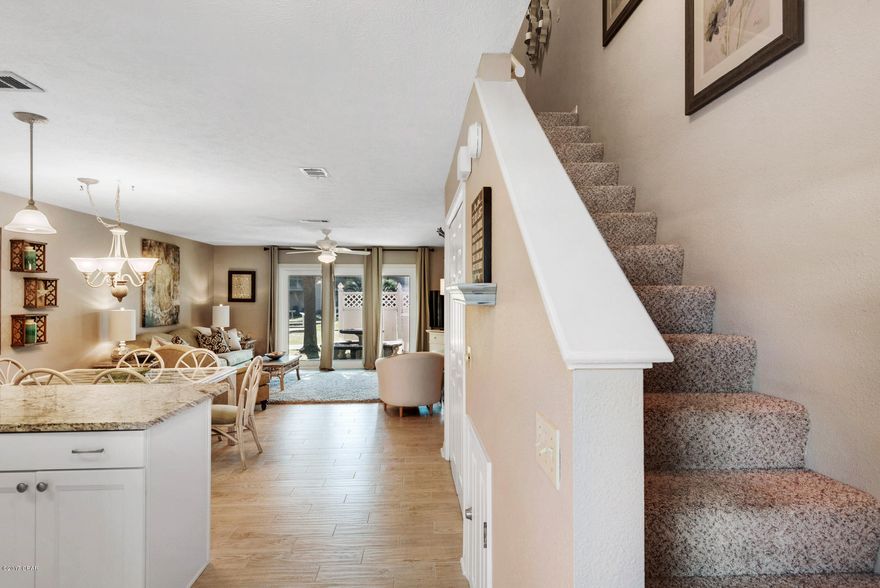 **ONE OF ONLY 6 OF THESE FLOOR PLANS IN ALL OF GULF HIGHLANDS** This 3BR/2BA is in fantastic condition and has only been used by family, friends and an occasional snowbird. The owners added many upgrades in 2015. This 3BR/2BA unit in the Gulf Highlands neighborhood has a unique character and is incredibly close to the emerald water and soft sand. UPDATES INCLUDE: gorgeous granite countertops that contrast well with the white cabinetry and tiled backsplash, beautiful light wood flooring, and modern decor. 

The large windows open up the main living space and bring it a beautiful amount of natural light. With the two stories, the master is located on the ground floor separating it from the other two rooms and providing more privacy. 
Outside, there is a nice size patio with a privacy fence, there is plenty of space for a grill and outdoor seating. 
Just off Hutchison Blvd, you are located near restaurants and shopping and just a short drive to Pier Park and 30A for a fun afternoon or evening out. 
Gulf Highlands offers a private beach club with a pool, snack bar, restrooms, and beach access. Your parking is right outside your door, so you don't have to park in a parking garage and walk a far distance to get inside. The complex is family friendly and gated for additional privacy.  With a total of 11 pools (5 heated during the winter) an exercise room tennis courts, a putt-putt golf course, and shuffleboard courts, there is always something to do.