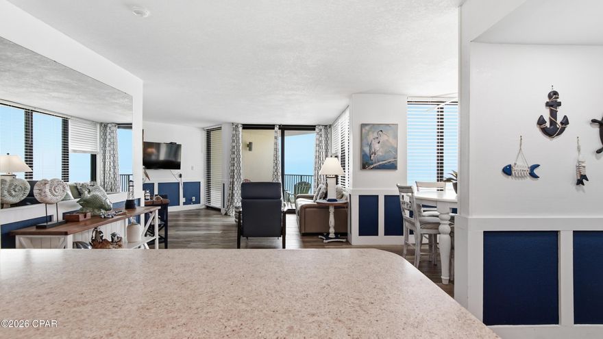 This A floor plan, the largest one bedroom layout at Sunbird, offers 751 square feet of well arranged living space with luxury vinyl planks positioned directly on the Gulf and beach. The kitchen features upgraded white cabinetry, a breakfast bar for casual seating and opens to an oversized living room surrounded by windows with a sliding glass door leading to the covered Gulf front balcony. A separate dining room with a window provides flexibility and can easily be converted into a second sleeping area. There is also an additional flex space between the kitchen and living room that works well as a dining area, office, sitting room or could accommodate a Murphy bed along the existing wall. The king size bedroom includes a rare walk-in closet. Some owners have modified the doorway with glass French doors to capture Gulf views from the bedroom. The bathroom is the largest design available in the building and includes a super-sized vanity with generous counter space. If you are seeking space, layout versatility and true beachfront positioning within Sunbird, this 1-bed Gulf-front condo at Sunbird stands out.
Sunbird is a gated community with freshly painted pillared fencing, refreshed buildings, completed repairs, newly painted parking areas, updated landscaping and decorative water fountains at each tower. Amenities include three pools with the west pool heated, composite sun decking, gas grills, a fitness center with upgraded equipment, a nearly new pickleball and tennis court and three private beach walkways. Located within walking distance to popular restaurants, beach bars and the soon to open Tootsies, this 1-bed Gulf-front condo at Sunbird is ideal as a primary residence, second home, or investment property with short term rental potential.