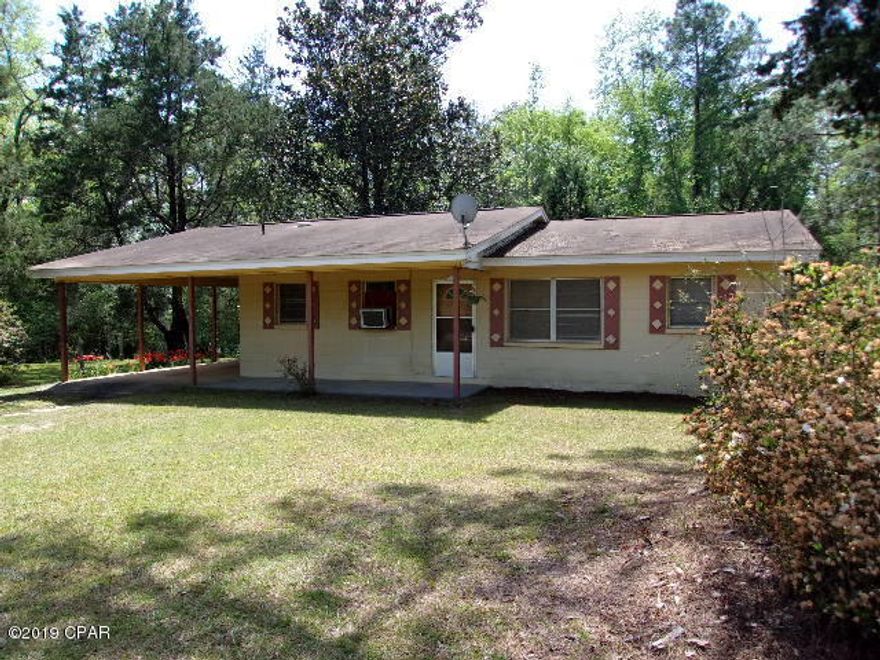 3 Bedroom 1 Bath Block Home on 11 Acres. Eat in Kitchen. Good size living room.  Attached carport. Metal storage building. Has gas space heaters and window air conditions. No appliances. Just needs a little updating and a little TLC. Land is wooded with lots of wildlife(deer and turkey) and great for hunting. Frontage on county maintained road not far to paved road and to the Alabama State line.