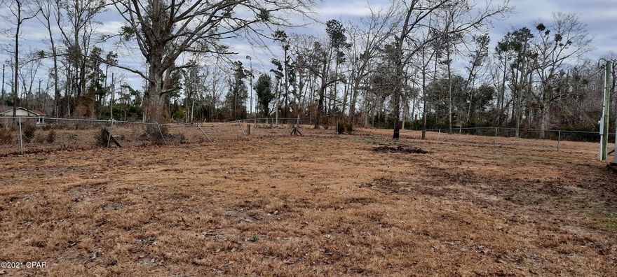 9.18 Acres partially fenced, mostly cleared land with 2 PONDS not stocked, a QUONSET HUT to store your equipment in, a CERTIFIED WORKING SEPTIC TANK, a PUMP near the ponds that needs work, 2 POWER POLES, A BARN that was used for goats, needs work. Live like you are in the Country, but only ten minutes from Marianna, 45 minutes from Panama City Beaches, 45 minutes from Doth, Al.
