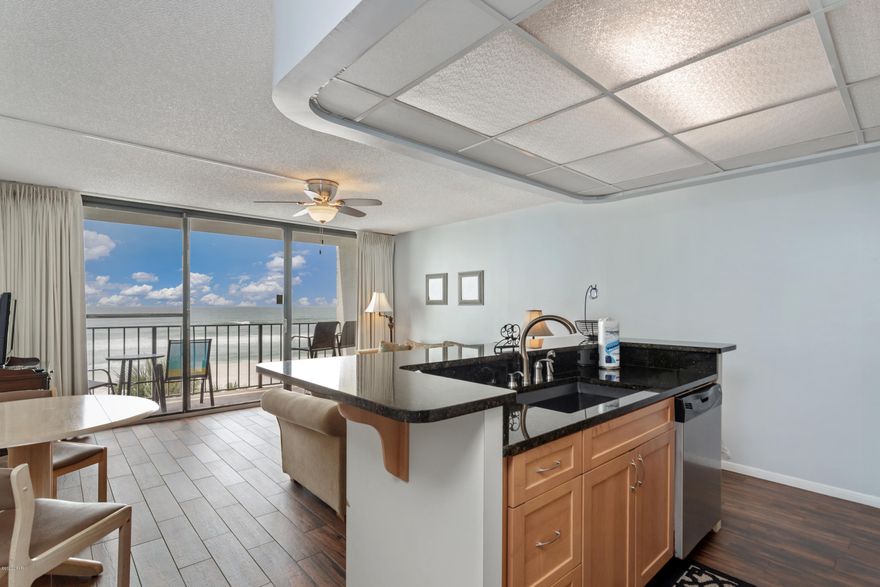 Welcome to the well renowned, Edgewater Beach & Golf Resort in Panama City Beach! This updated one-bedroom one-bath condo is located in the desirable Tower III and boasts a beautiful gulf-front view right from the living area. This gulf-front unit features a private balcony, open floor plan, and floor to ceiling windows & doors bringing the outside in. Enjoy stunning views of the Gulf of Mexico from inside the unit or relax on the private balcony overlooking the expansive pool area. The kitchen has been beautifully updated with stainless steel appliances, granite countertops, contemporary cabinets, and a beautiful hardwood-finished LVP. The master bedroom provides plenty of room with a queen bed and flat-screen TV. This unit currently brings in roughly $25,000/yr in rental revenue. Edgewater is filled with fantastic amenities including, but not limited to; a gorgeous white-sandy beach, Polynesian-styled lagoon pool, eleven pools in total, six reflecting ponds, Plexicushion tennis courts, four hot tubs, shuffleboard, restaurants, salon, spa, and golf. There are many restaurants within walking distance, so you shouldn't need to leave the property. Since the resort is extensive, there are golf cart shuttles to take you wherever you'd like to go!