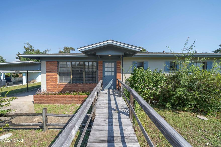 Discover this charming 3 bed, 2 bath single family home just steps from St. Andrew's Bay. Centrally located between downtown Harrison Avenue and Beck Avenue, this well-maintained home features original hardwood floors and a large yard. Don't miss out on this perfect blend of convenience and coastal living! Schedule a showing today.