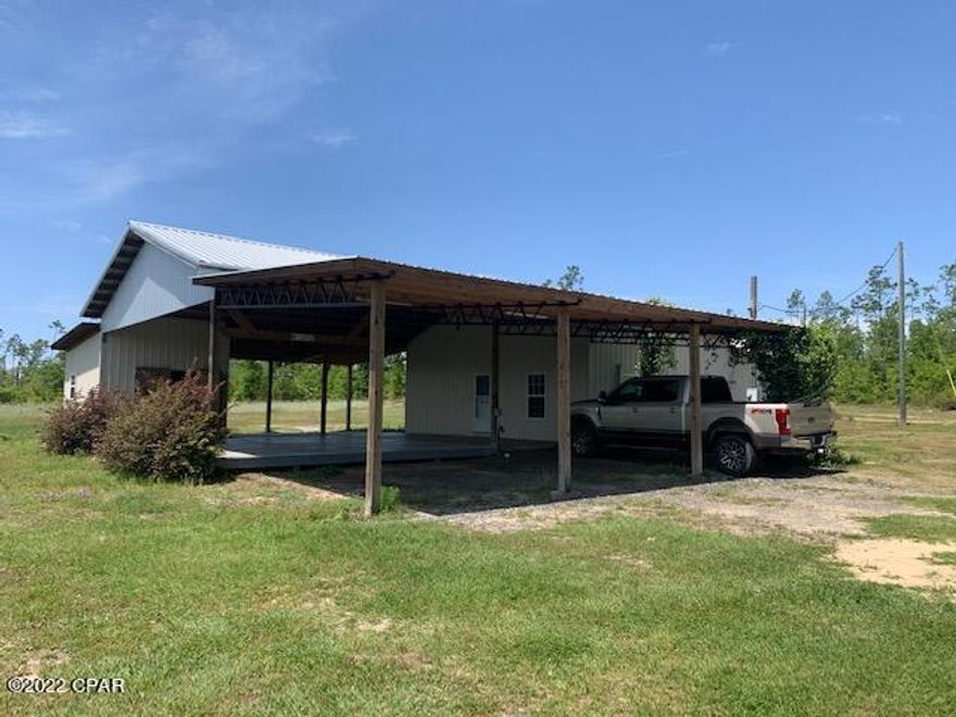 Have you been looking for a secluded getaway?  This is it.  One of a kind, 2BR/2BA home on 33 acres.  Huge porch with outdoor kitchen.  Tons of storage with 2 large barns.  Call today to schedule a showing.