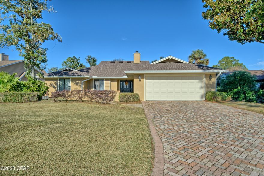 CURRENTLY UNDER CONTRACT, SELLER ACCEPTING BACKUP OFFERS. Great family home in Bay Point featuring a new roof and AC! This 3 bedroom, 2 bath home has a bonus room that could easily be used as a 4th bedroom or office. There are porcelain tile floors that run through out the living area and kitchen of the home. The eat in kitchen has a picture window overlooking the 5th tee of the Meadows golf course and a covered outdoor dinning area off the kitchen. The family room has cathedral ceilings, fireplace and sliding doors that lead to a heated and cooled Florida room. The spacious fenced in back yard could easily accommodate a pool and makes for a great play area.