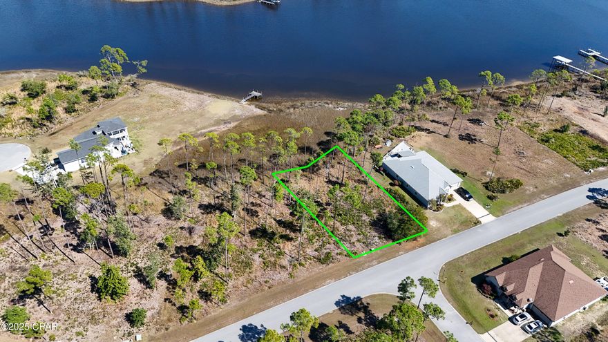 Exceptional Waterfront Homesite in the Coveted Laird Point Community

This stunning waterfront lot offers the perfect setting to build your dream home in the highly desirable Laird Point community. Enjoy breathtaking sunrise views, and the rear of the property is shaded in the evenings, making it ideal for outdoor living. Laird Point is a gated, waterfront community with underground utilities and beautifully designed ribbon-curbed streets. Residents enjoy a range of amenities, including secure gates, a tennis court, and convenient RV/boat storage. With no set time to build, you can secure this incredible location now and build when the time is right. The lot is just minutes away from a full-service marina and boat launch, and offers excellent proximity to Tyndall Air Force Base, Mexico Beach, and Panama City Beach, all within a short drive.