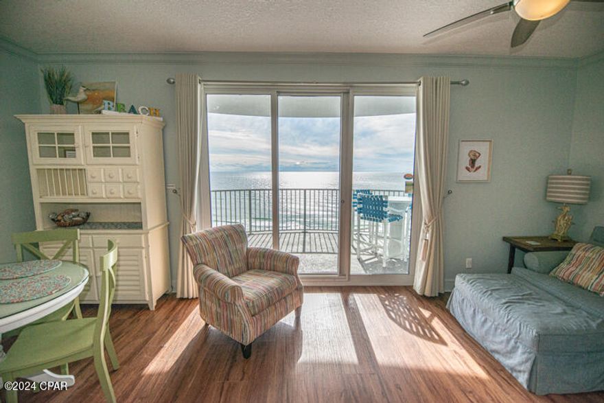 CURRENTLY UNDER CONTRACT, SELLER WILL CONSIDER BACKUP OFFERS Escape to paradise. Twin Palms is a modern, low-density building, with low assoc. Dues. It is directly on what has been widely acclaimed as one of the world's most beautiful sugar white sandy beaches. This modern Condo with ten-foot ceilings, crown molding, and floor to ceiling windows, that allow for extraordinary unobstructed views of the Gulf of Mexico as well as excellent views of the beach, left and right as far as the eye can see. The breath-taking views of the Gulf of Mexico from the living area and kitchen are mesmerizing. The covered balcony is the largest in its class; there are no others in this market available with a deeper balcony. Your personal balcony gives you exclusion from your neighbors on both sides, for a truly private experience. This will be a great source of pride. This 11th floor unit is not too high or low. it is perched perfectly. 
This luxurious unit features a Master one bedroom, with two full bathrooms, with bunks in the hallway. The master bedroom is oversized and has its own private full-size bathroom. The guest bathroom is also full-sized with separate access for greater privacy. This Beach Condo is fully furnished and is tastefully updated, with a new efficient heating and cooling system. This well cared for condo is ready to pay for itself, as it does allow for short-term rentals. Since this is a low-density resort with only 5 condos per landing; overcrowding of its amenities has never been an issue. The kitchen features updated appliances, a granite breakfast bar and a separate closet with a washer and dryer. There is also a large storage closet outside the unit to keep your beach supplies, bicycles, or fishing gear or anything that you don't want in your new condo. 
As an owner you will enjoy the beachfront pool, the sauna and the gym. The secure, gated garage is covered, with parking directly below the condo, next to the elevators, not across the street like most others.  At Twin Palms, Owner pets are welcome, and the City's approved dog beach, and dog park, are nearby, also it is just a few minutes from the bustling Pier Park, and the world acclaimed, St. Andrews State Park.  An international airport is just 30 minutes away. Seller is motivated.