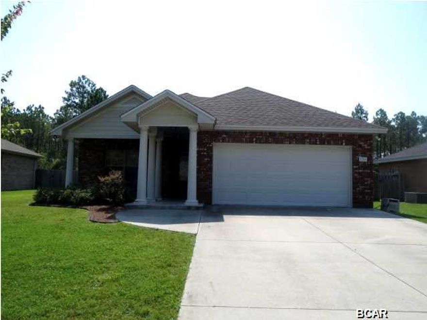 BEAUTIFUL CUSTOM-BUILT INTERIOR features are found in this stunning all-brick home in the desirable Camryns Crossing neighborhood! This home includes a kitchen with Frigidaire appliances, custom cabinets with additional cabinets on the outside of the breakfast bar, granite countertops, and hardwood flooring throughout the entire home! The Master bedroom is located at the far end off the Great room with a large walk-in closet and a Master bath with a double vanity. The two additional bedrooms have a Jack-n-Jill style bathroom. There is a covered patio off the eat-in kitchen for easy barbeques and a screened porch overlooking the spacious back yard with a natural preserve behind the home. This home is a must see!