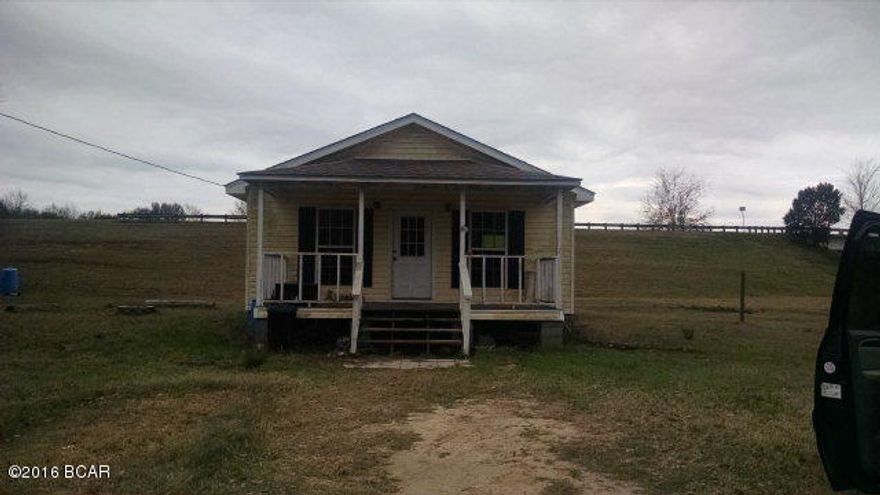 PRICE REDUCED!!!What a Cutie!! This 2 Bedroom 2 Bath home has 1056 sq ft. Located in Grand Ridge on 1.07 acres. There is nothing to do in this home but move right in! All appliances, Wood Floors, Open floor plan!! Built in 2009! T