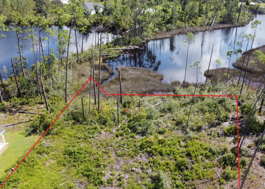 A Beautiful homesite in the desirable Laird Point! This lot is very unique as it offers views of Laird Bayou and a Freshwater Lake in Laird Point. This is a non dockable  homesite per the Hoa, but you can access the water by foot or Kayak, or just fish from your backyard. Laird Point is a gated waterfront community with very nice homes and several more under construction. No pre-set time to build so you can lock in your spot and build when the time is right. All underground utilities and city water/sewage. Beautiful ribbon curbed streets. Great proximity to East Bay and Mexico Beach. East Bay offers the best redfish and speckled trout fishing in Panama City. Just minutes to Tyndall AFB.