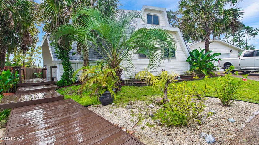 CURRENTLY UNDER CONTRACT, ACCEPTING BACK UP OFFERS. SPACIOUS OPEN CONCEPT LIVING with all the UPGRADES located on a large lot! Don't miss this incredible opportunity to have your dream home located minutes from the Navy Base, great restaurants and the white sand beaches, but tucked into a quiet small neighborhood. This unique home offers high ceilings and open spaces with a flexible floor plan. The inside features ''wood look'' tile flooring, wood feature walls and loads of natural light. The new kitchen includes solid wood ''soft close'' cabinetry, STAINLESS APPLIANCES and striking marble counter tops on counters and  CUSTOM BAR area. Perfect for entertaining! Modern metal cable railings on the stairs and loft area give the home an updated look that's perfect for a home  office or library Outside, you'll enjoy the landscaping, covered deck and screened porch that includes an awesome SWIM SPA. The spacious backyard has lots of space for gardening and includes a convenient work shop. A 2 car garage and circular driveway allow for loads of parking space. If you've been searching for something a little different than the typical"cookie cutter" house that's in "move in" condition, this  will be the perfect place! No HOA's or Flood insurance required!