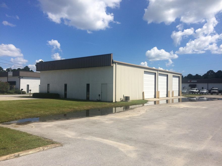 4,000 square foot building divisible into two, 2,000 sq. ft. units. Unit ''A'' has +/-1,700 sq. ft. of office with a small warehouse/storage area, load-bearing mezzanine above the office and a single rollup door in the back.  Unit ''B'' includes +/-1,200 sq. ft. of office, load-bearing mezzanine above the office and two, street-level +/-14,x14' rollup doors.  Very low rental rate.  Leased ''as-is''.  Landlord will allow medication of the exiting build-out.  Zoned C-4, Bay County.