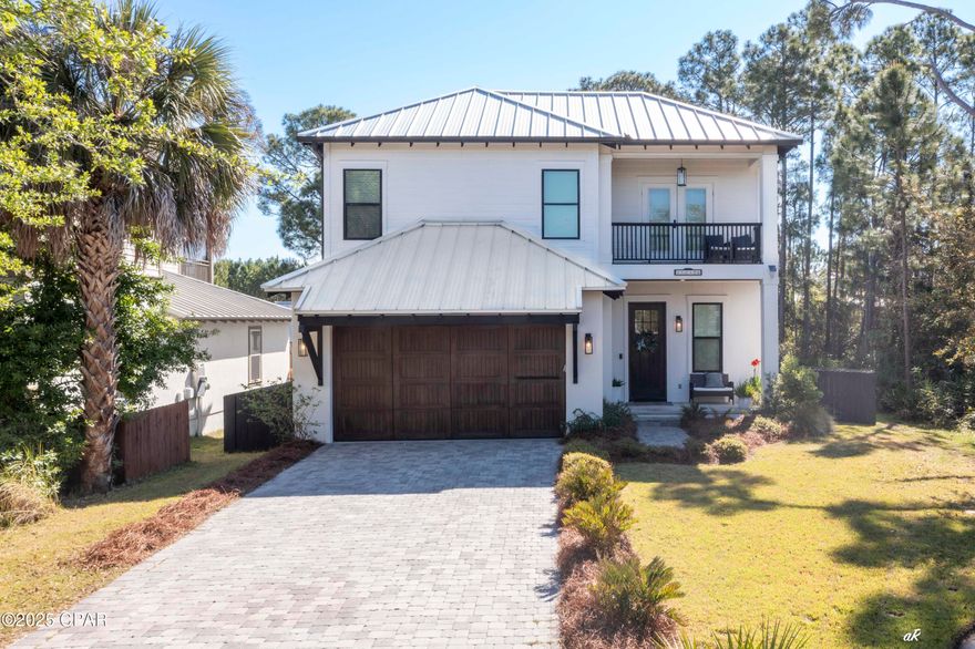 Stunning CUSTOM HOME in the Gated Community of Martinique

Experience luxury living in this 2021-built custom home located in the exclusive gated community of Martinique. This 4-bedroom, 2.5-bathroom residence boasts exquisite craftsmanship along with high-end finishes and impact glass window throughout.

Step inside to find stained concrete floors on the main level and luxury engineered wood flooring upstairs. The chef's kitchen is a showstopper, featuring custom wood beams, designer lighting, detailed trim work, and stylish wallpaper accents. The first-floor master suite offers a spa-like retreat with a stunning tile shower.

Enjoy Florida's beautiful outdoors on the covered patio with a real wood-burning fireplace, perfectly positioned to overlook the community's conservation area and walking trails. The brick paver driveway adds to the home's curb appeal, while access to the community pool enhances the resort-style experience.

Located on the desirable east end of Panama City Beach, you're just a short walk to Captain Anderson's and The Grand Marlin for waterfront dining. Keep your boat just across the street at Lighthouse Marina, making it easy to enjoy days on the water.

This home offers the perfect blend of elegance, comfort, and convenience—come experience the best of coastal Florida living!