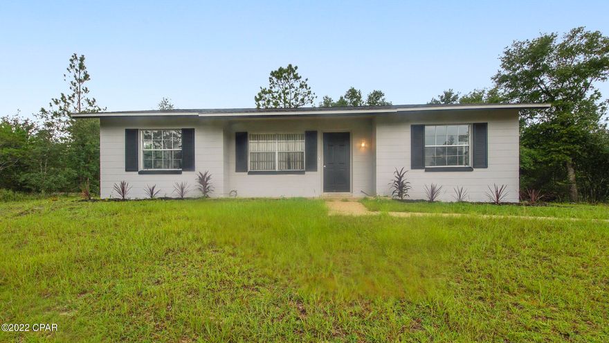 Super charming block on slab home, 2 bedrooms, 2 baths with a great large living area, split bedroom, entirely new kitchen, cabinets, counters, appliances, large laundry room, Propane gas stove and water heater. New roof in 2018. New HVAC 2020. Swimming and fishing with many lakes and ponds in subdivision. Subdivision amenities available to property owners. Lot is located adjacent to a 0.7 ac lot designated as a ''Retention area'' owned by developer and will not be developed. Sunny Hills is conveniently located about mid-way between Panama City and Chipley. Great location with paved roads and lovely community feel. 18 hole golf course. Take a look at this lovely quaint home today!! 

(All sizes approximate and taken from public records)