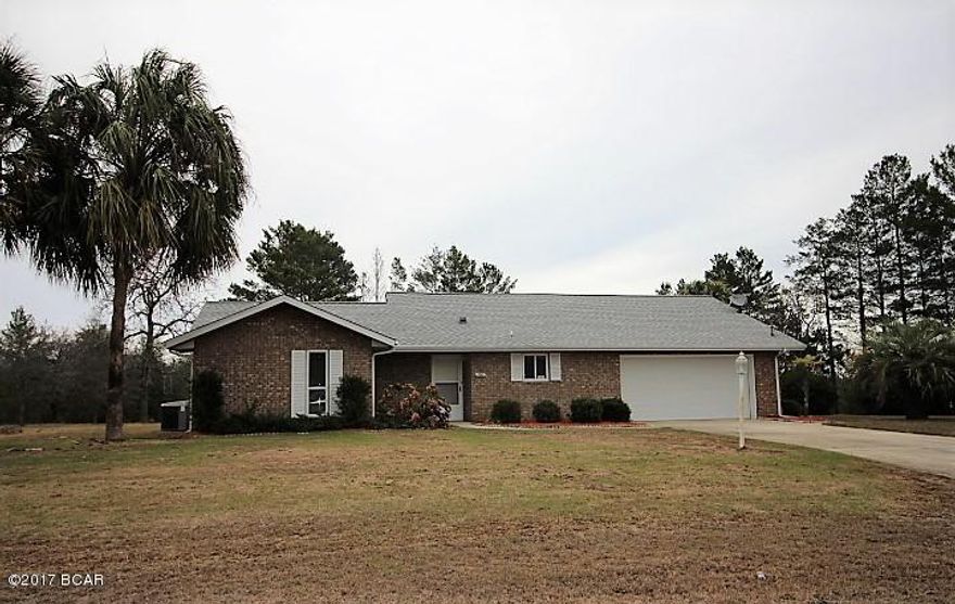 This is a very nice 2 bedroom 2 bath home that has had many new updates including new carpet, fresh paint, new French doors and new kitchen appliances.  It has a 2 car attached garage and sits on 3 lots for a total of approx. 1.014 acres. There is a chain link fenced dog pen in the back yard  It has very nice landscaping and will be an ideal place for your new home!  It is just north of Panama City and south of Chipley.  The beaches are just a short drive away and it is conveniently located to the airport.