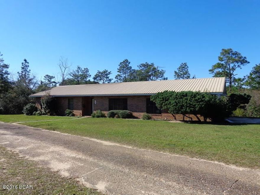 WATERFRONT ON BLUE LAKE. This is an all natural 5 acre spring fed pond. Great fishing and enjoy swimming. 145 ft frontage on pond. New boat dock totally rebuilt with pressure treated wood in 2012. Only the property owners around pond have access. End of dock water is 14 ft deep, pond is believed to be 35ft deep. Great view of pond from the back sun porch. 3/2 all brick ranch that was built to original owners specs. Metal roof new in 2003. Spacious living room, kitchen & dining room combo which all the newer energy saver appliances will convey even the front load washing machine. Laundry room with plenty of cabinets and counter tops for storage plus an open pantry. 2 compact car garage that has additional storage room that houses the water softner, attic access plus garage has it's own H/AC ceiling fans, auto garage opener & inside water spigot. Master bath with new laminate tile flooring & new paint. 16x20 workshop with 2 car carport. Insulated workshop has built in work bench & shelving, AC window unit new in 2015, wired for DSL, mop sink, wood floor, high ceilings, flood lights, water & electric. Garden area, fruit trees, flowering bushes, walking paths & newly fenced back yard for pets. 100 yard shooting range with 3 berms, one at 25, 50 & 100 yards. Most of White Drive is paved to house. Close drive to Hwy 231.