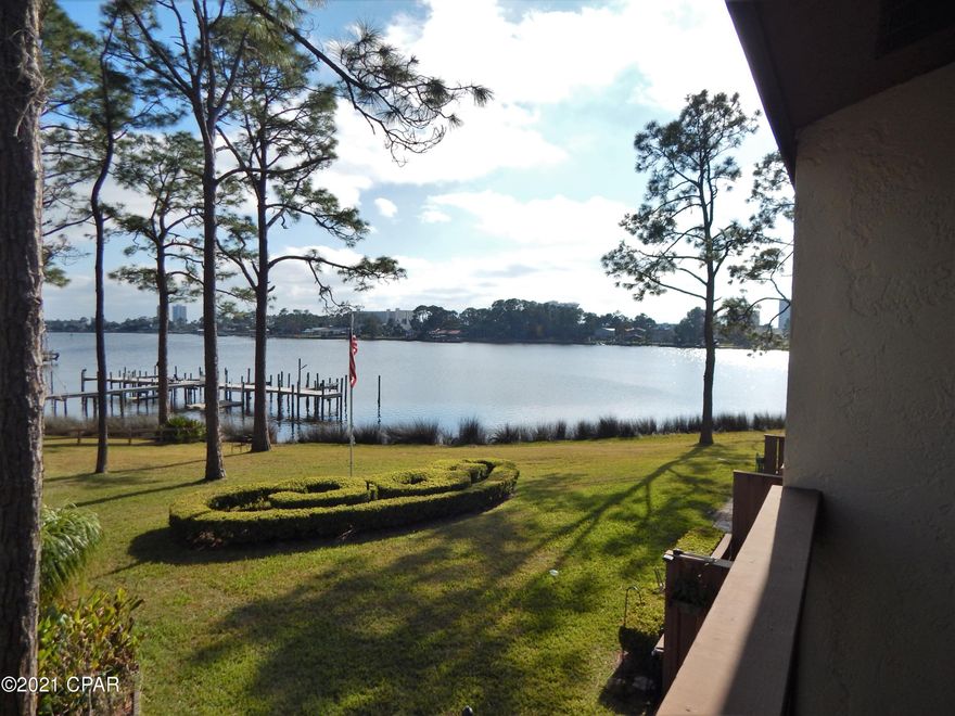 You'll love this condo & this waterfront community -  Located on Grand Lagoon with a dock, boat slips, & easy access to the Gulf .  Convenient to beaches, Navy Base,  restaurants, shopping, & entertainment, 

 Unit has a covered carport & extra space. Beautiful view of the water from the condo.... Sliding glass doors were replaced a couple of years ago.  New LVP flooring.  Request a showing  & you'll be glad you did. All information  & measurements should be verified if important.