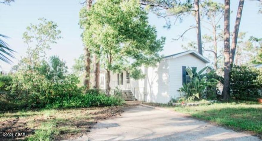 Very nice 2 bedroom 2 bath mobile home with large covered front porch, fenced yard, beautiful flooring. Walking distance to marina, only 3 miles to BEACH, AND 2.7 miles from Navy Base. Very centrally located to PCB and PC.