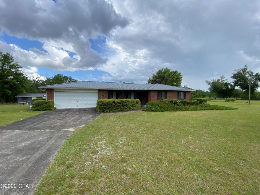 Turnkey 3 bedroom, 2 1/2 bathroom brick home on 4.69 acres with a pond. This is the perfect home for a growing family with plenty of indoor and outdoor space for kids and animals. This home features an attached garage, large patio, wood-burning fire place, Florida room, attached garage and out building with lean-to. There are Pergo laminate (wood-look) flooring throughout the home except in the kitchen and bathrooms where there is tile. The master bedroom has en suite bathroom with tiled shower. The 4.69 acres is entirely fenced in and has a wrought iron gate on the driveway entrance. The pond is on the back of the property and there is a second well to the pond with well house. The home also comes with an ADT security system. There is a termite bond on the house.
