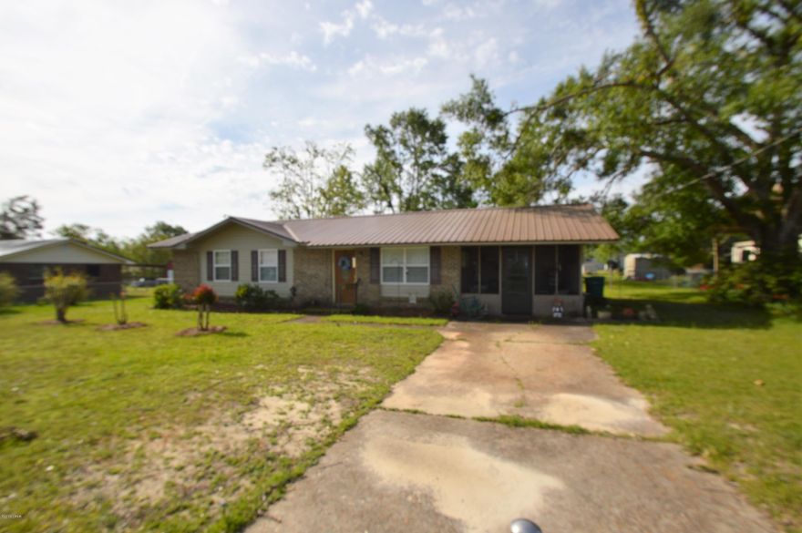 This three bedroom, 1.5 bath home is too cute!  The front of the home is fenced, and the home features a metal roof.  The kitchen and dining room are open to one another, making this a great space for entertaining.  Bathrooms updated, metal roof all on a double lot.This is a must see!!!!